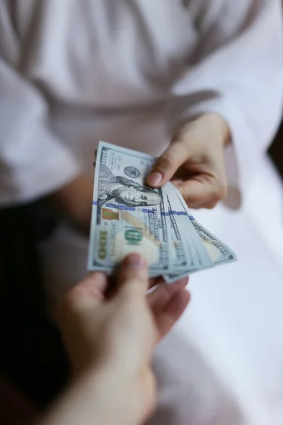 Arms transfer money — Stock Photo, Image