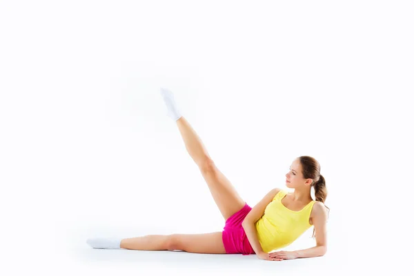 Bastante deportivo fuerte delgado y en forma joven sentada, haciendo spl —  Fotos de Stock