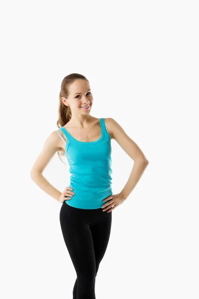 Ung vacker kvinna poserar i en gym-outfit. — Stockfoto