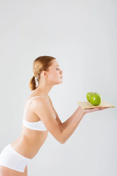 Chica con manzanas verdes — Foto de Stock