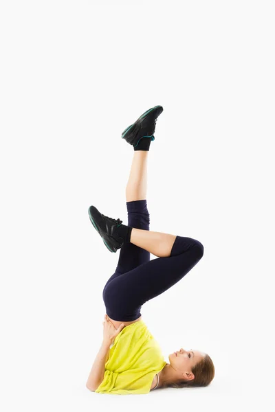 Young gymnast exercising on white — Stock Photo, Image