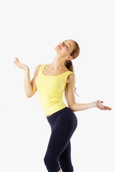 Fitness girl spreads his arms out to the side and smiling. — Stock Photo, Image