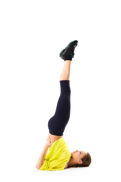 Sporty girl doing stretching exercises. position on the head upside down — Stock Photo, Image