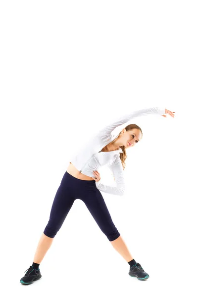 Young beautiful sports girl does fitness exercise stretching — Stock Photo, Image