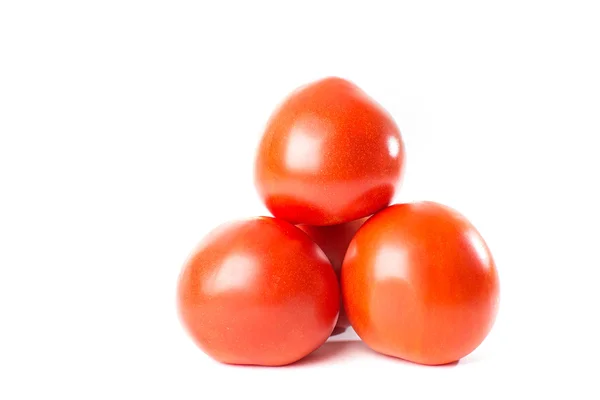Червоні помідори на білому тлі — стокове фото