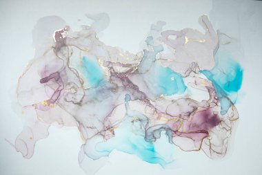 Abstract fluid art painting background in alcohol ink technique, mixture of magenta, purple and blue paints. Transparent overlayers of ink create glowing golden veins and gradients.