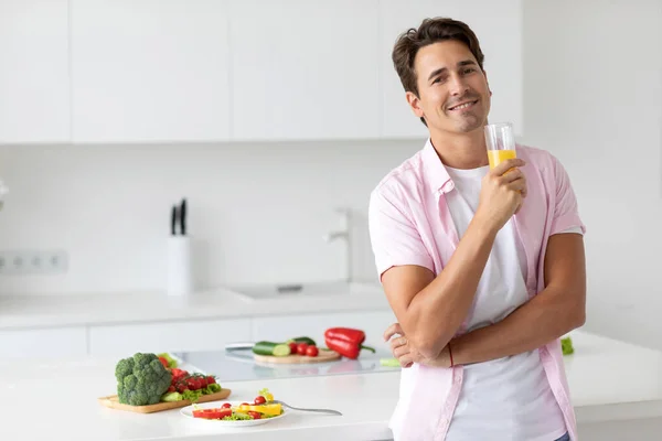 Smiling Man Drinking Orange Juice Kitchen Looking Camera Healthy Lifestyle — Stok fotoğraf