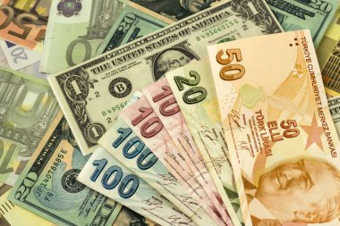 A pile of Turkish Money on the currency exchange,dollar and euro banknotes,top and half view