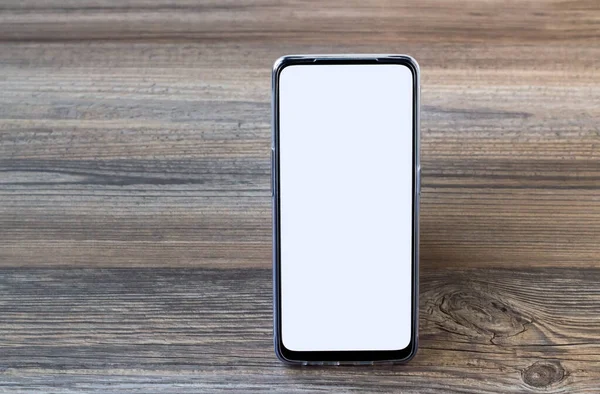 Smartphone Mit Weißem Leerbildschirm Steht Auf Holzfläche Mit Kopierraum — Stockfoto