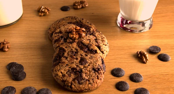 Hazelnuts with handmade buscuits and a glass of milk — Stock Photo, Image