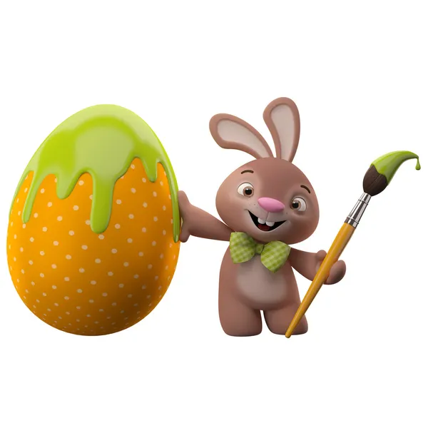 Easter bunny with egg and brush — Stock Photo, Image