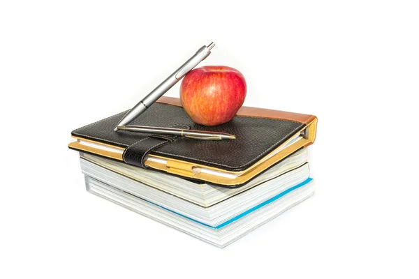 Books and apple on white background — Stock Photo, Image