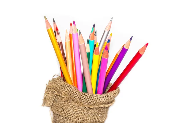 Colour pencils and notebook on white background — Stock Photo, Image