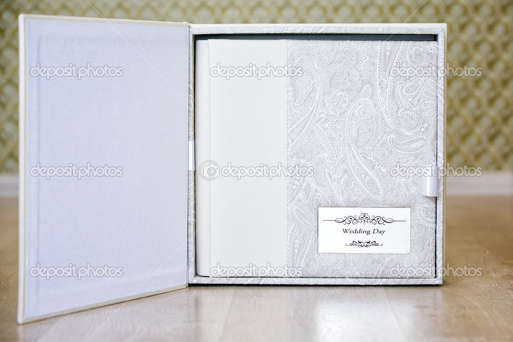 Wedding photo book with leather combined cover and metal shield.