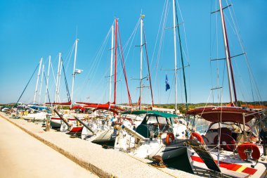 Yachts at sea port in Greece town clipart
