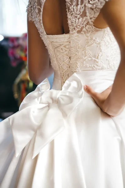 Beautiful wedding dress with bow at waist — Stock Photo, Image