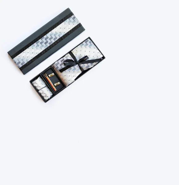 Cufflinks, tie, tie clip, handkerchief in box. Isolated on white — Stock Photo, Image