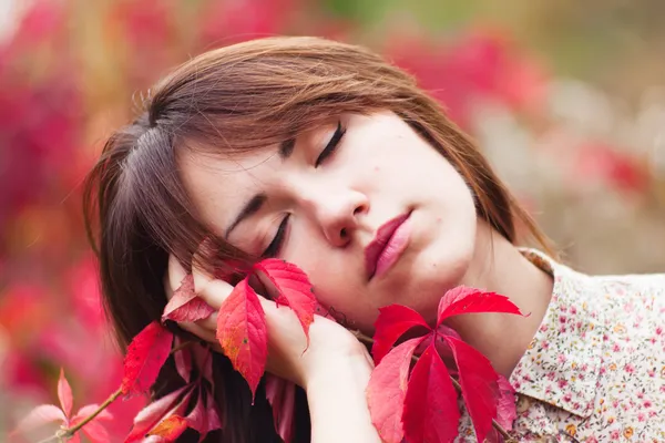 Portrait with red leaves — Stock Photo, Image