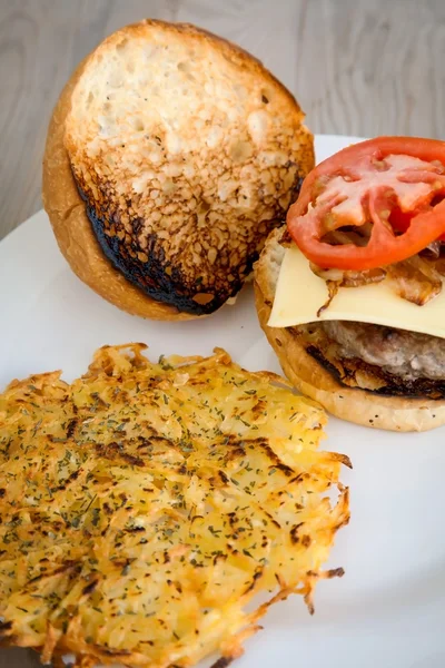 Hamburger with cheese tomatoes and onions — Stock Photo, Image