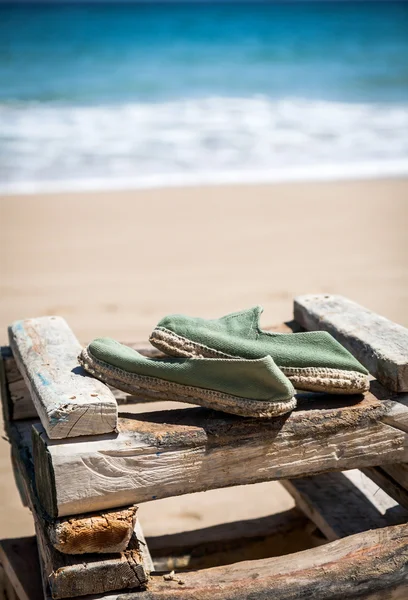 Wooden shoes on the beach — Stock Photo, Image