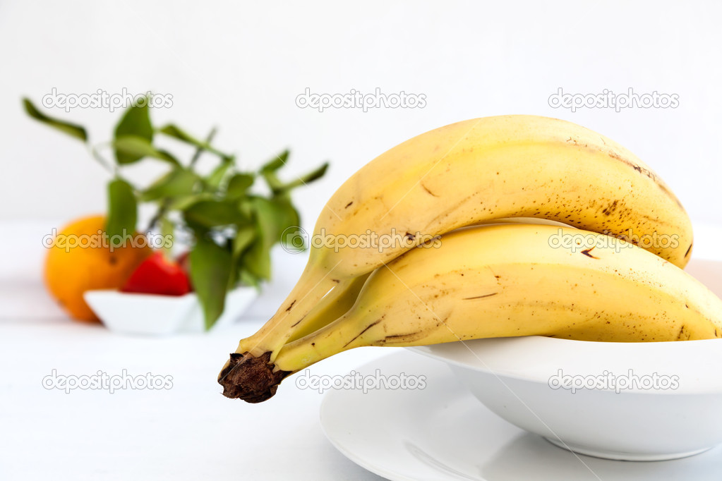 Bananas on white plate