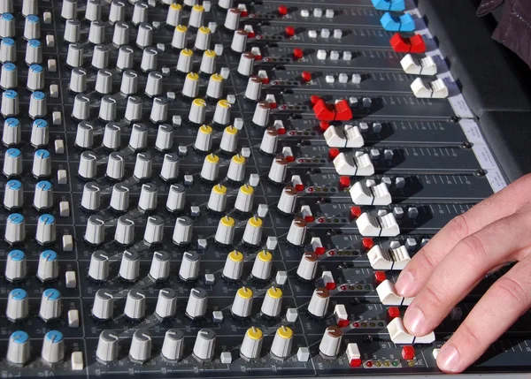 Hand of the sound producer and mixer console — Stock Photo, Image