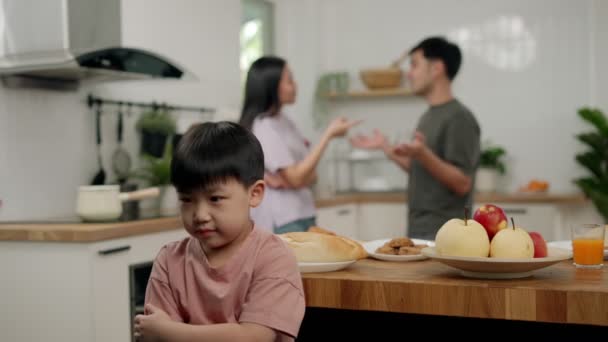 Asian Boy Kid Sitting Use Hands Close Ears Because Parents — Stock Video