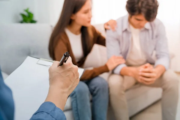 psychologist or psychiatrist records the treatment and therapy of adolescent couples in a psychiatric clinic or hospital. Patients reported symptoms of depression, stress, irritability, and love problems.
