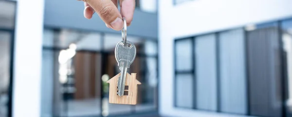 Selling home ,Landlord and New home. The key for unlocking a new house is plugged into the door. Mortgage,loan, rent, buy, sell, move in, move out, relocation