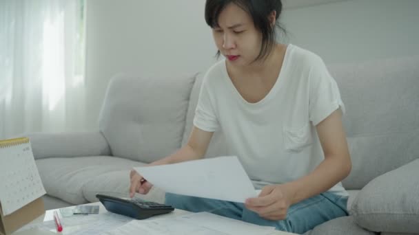 Stressed Headache Asian Woman Large Bills Invoices Money Pay Expenses — Stock Video