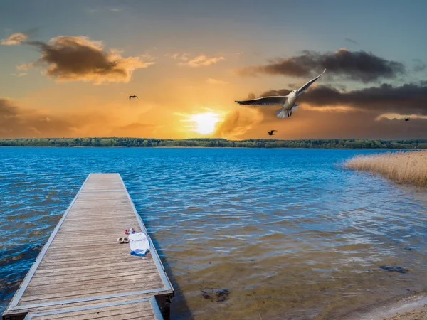 Jetty in the sunset at the Mecklenburg Lake District