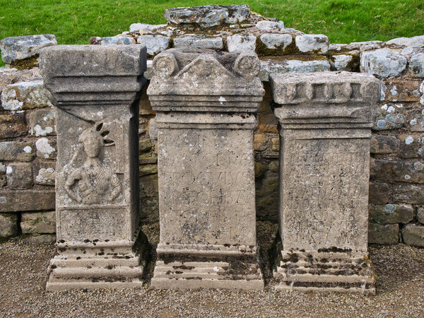 Three altars at the Temple of Mithras near Hadrian's Wall at Carrawburgh in Northumberland, England, UK. The altars are replicas of those at The Great North Museum.