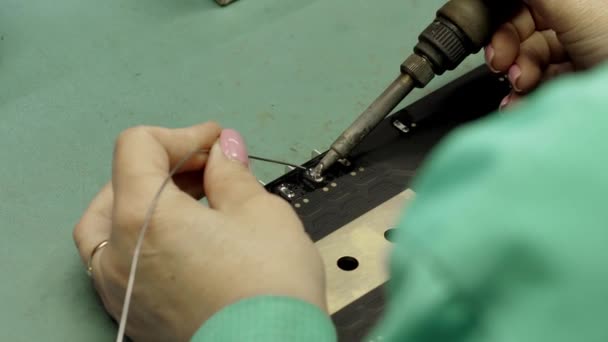 China Electronics Facility Female Engineer Does Printed Curcuit Motherboard Soldering — Stock Video