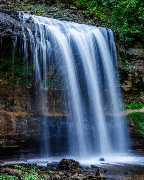 Wilke Glen and Cascade Falls in Osceola, Wisconsin during summer. Selective focus, background blur and foreground blur.