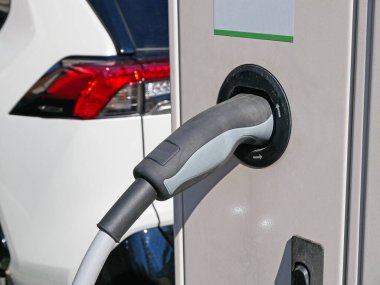 Charger station for electric vehicles clipart