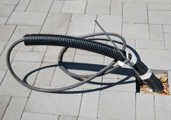 Cables Leading Out Paving Stones Street — Foto de Stock