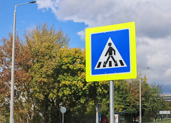 Pedestrian crossing road sign on the street