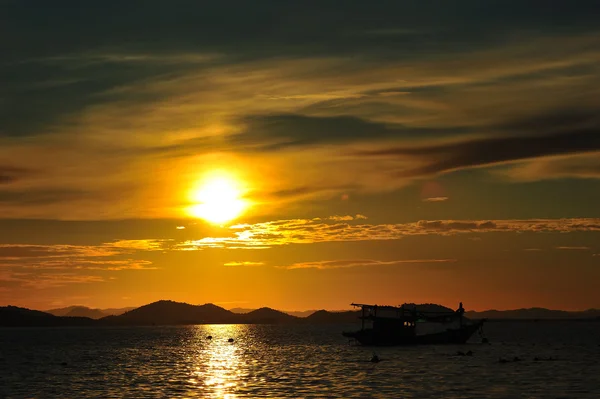 Fisherman boat during sunset — Stock Photo, Image