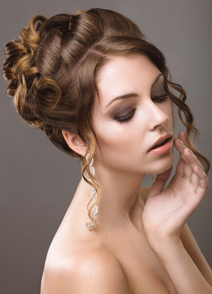 Beautiful woman with evening make-up and hairstyle