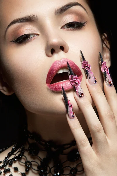 Beautiful girl with long nails and sensual lips — Stock Photo, Image
