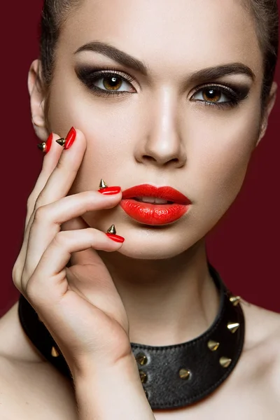 Beautiful woman with evening make-up and red nails with thorns. — Stock Photo, Image