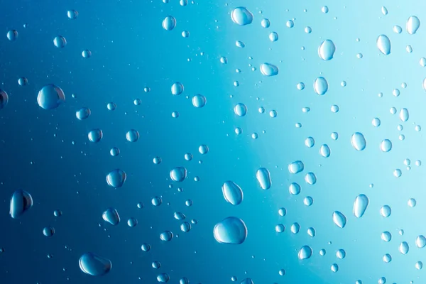 Wassertropfen Auf Blauem Hintergrund Wassertropfen Auf Der Oberfläche Makrofoto Spritzmuster — Stockfoto