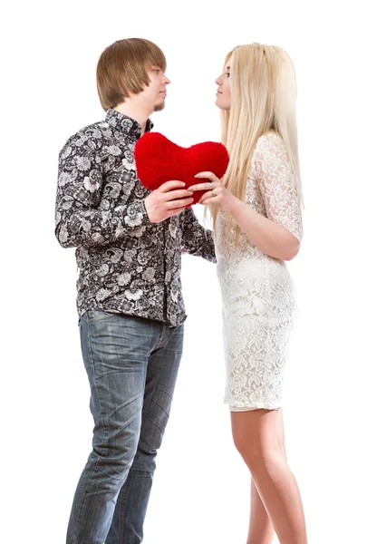 Young love couple holding red valentine's heart — Stock Photo, Image