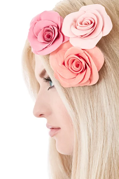 Beautiful young blonde woman with tender flowers in her hair — Stock Photo, Image