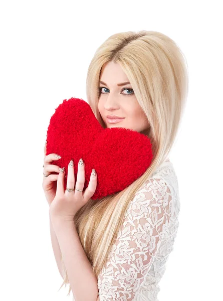 Beautiful blonde woman holding red heart — Stock Photo, Image