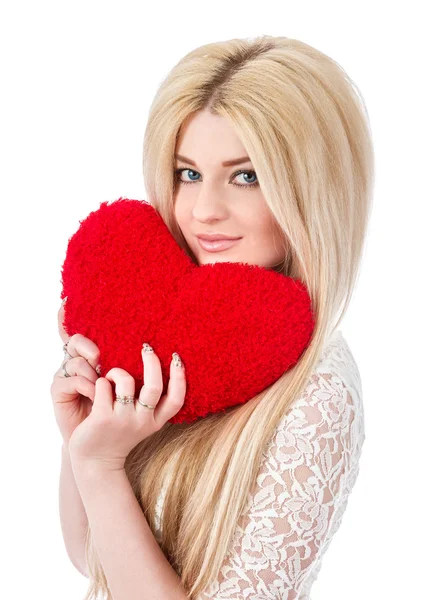 Beautiful blonde woman holding red heart — Stock Photo, Image