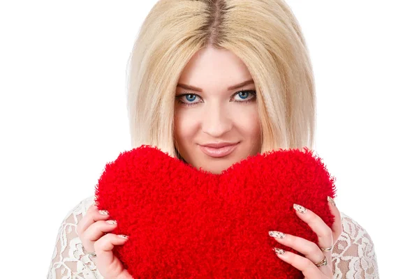 Beautiful blonde woman holding red heart — Stock Photo, Image