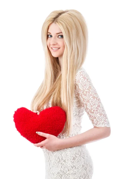 Beautiful smiling blonde girl with heart in hands — Stock Photo, Image