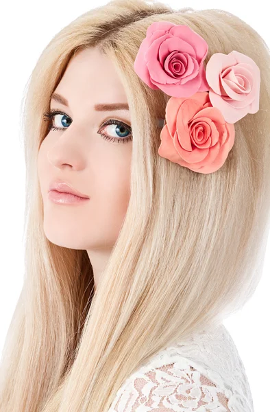 Beautiful woman with pink flowers in hairs — Stock Photo, Image