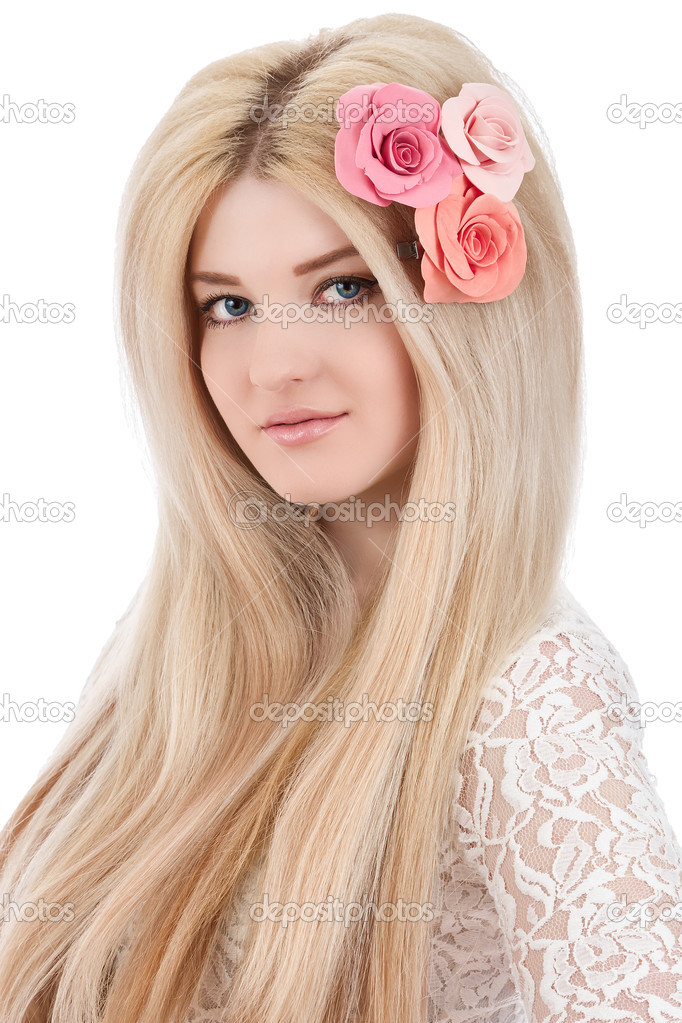 Beautiful woman with pink flowers in hairs